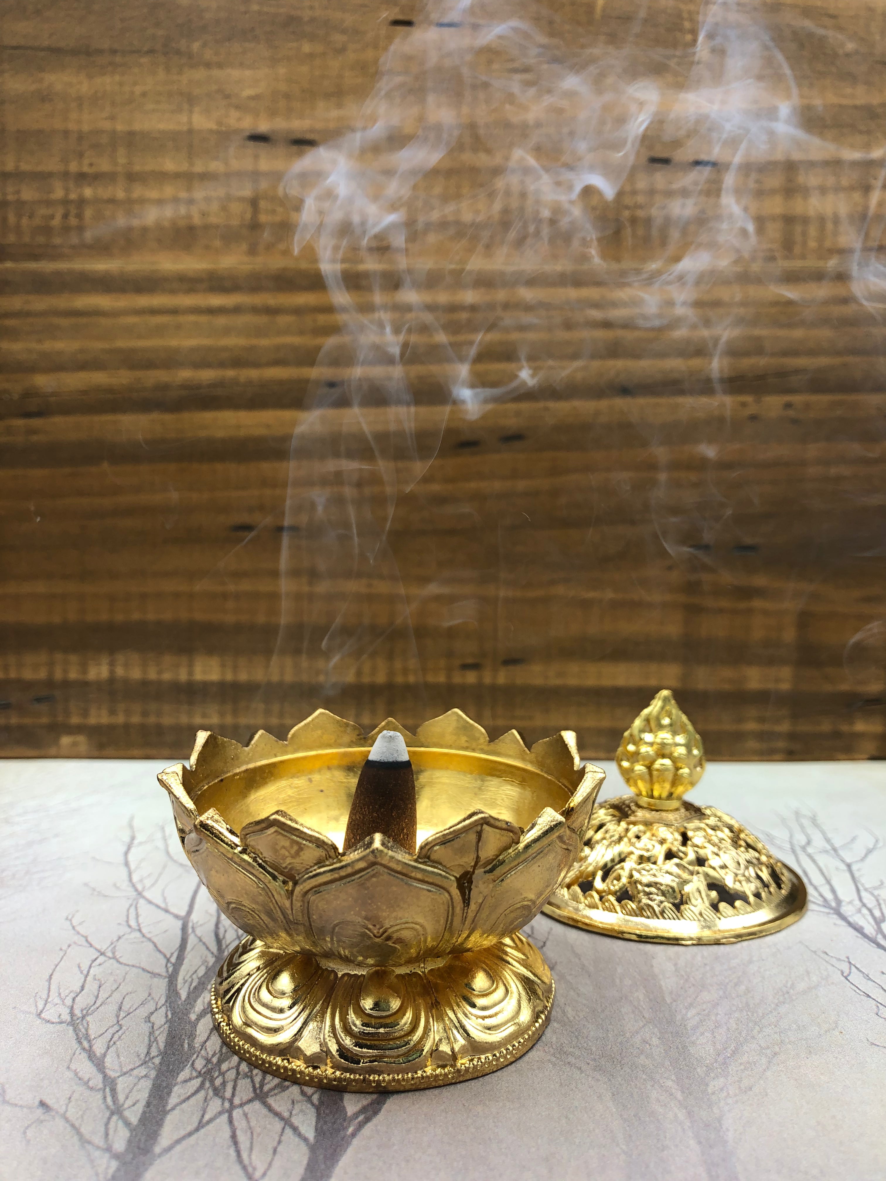 Auric Blends Incense Cones Burning in Brass Cone Burner